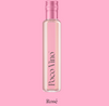 Bottle of Poco Vino Rosé on a pink background